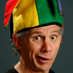 Errol in his rainbow heavenly court jester hat with his funny whimsical smile