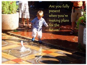 Little boy about to stop in puddle of fountain